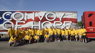 MSCA members and Convoy of Hope volunteers stand in front of a tractor-trailer full of supplies to be donated to the Palm Beach Food Bank.