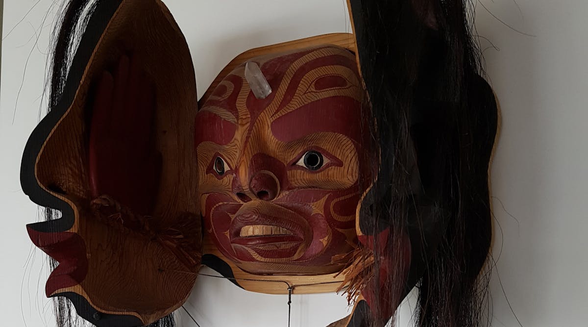 A transformation mask sculpted by first nations artist Simon Daniel James, tribal name Winadzi.