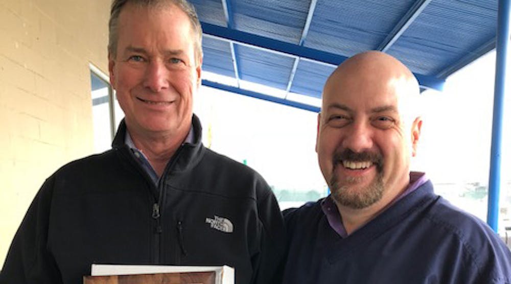Bill Frenzel (left), one of the three principals at rep firm Empire State Associates, accepts a 40-year award from Brasscraft&rsquo;s Regional Sales Manager Mark Duford.