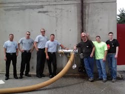 Outside the restored Ft Wayne Fire Department Training Facility are left to right Pvt Michael Moring Pvt Jared Beard Pvt Nate Mills Lt Kasie Platt all Ft Wayne firefighters from Station 1 Truck 1 AShift and personnel from Shambaughs Fire Protection Division who worked on the project right to left Rob Crowell Fire Protection Fitter Nick Sorg Fire Protection Estimator Josh Macke Fire Protection Designer Outside the restored Ft Wayne Fire Department Training Facility are left to right Pvt Michael Moring Pvt Jared Beard Pvt Nate Mills Lt Kasie Platt all Ft Wayne firefighters from Station 1 Truck 1 AShift and personnel from Shambaughs Fire Protection Division who worked on the project right to left Rob Crowell Fire Protection Fitter Nick Sorg Fire Protection Estimator Josh Macke Fire Protection Designer