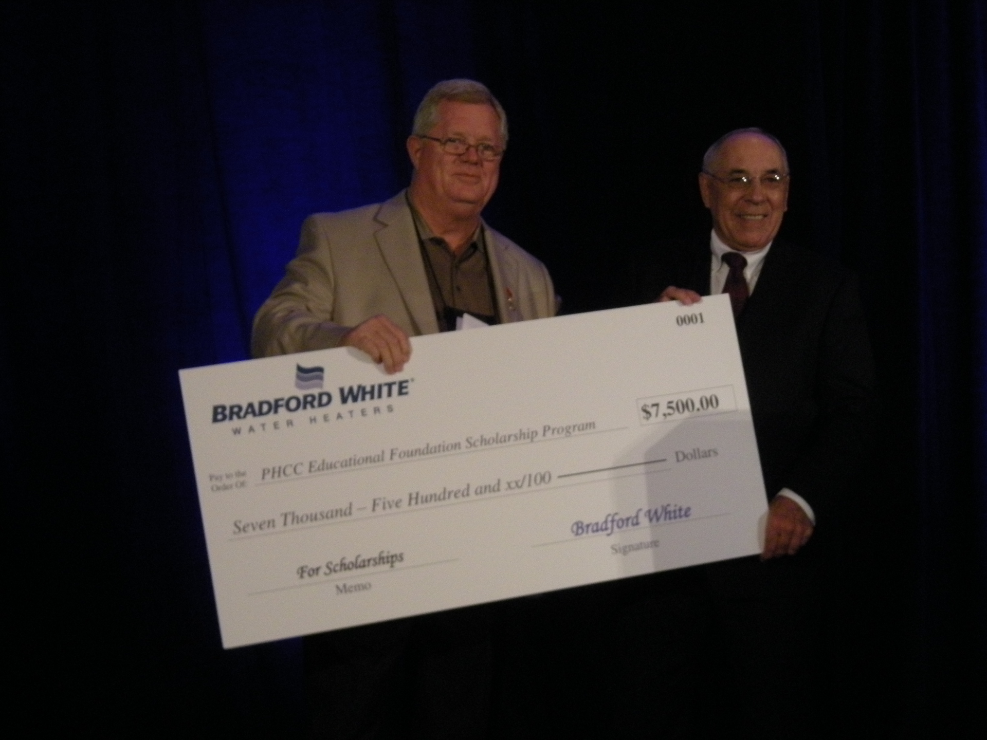 LeftBill Jones Head of the PHCC Scholarship foundation Right Bradford White retiree Ted Sikorski