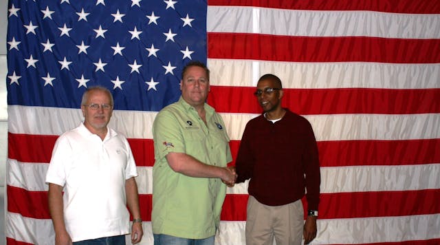 John Smith (center) is thanked for his work at the Challenger Space Center by the facility&rsquo;s Maynard Mast (left) and Tim Harris (right).