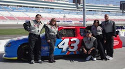Rich Diesel (right) and his wife Marci (next to him), share a proud moment at Richard Petty Driving Experience in Las Vegas, NV with Taco Trainer John Barba (next to Marci), Kim Ziner from Emerson-Swan, and Taco&rsquo;s VP of Eastern Regional Sales, Ken Andersen. Rich Diesel won Taco&apos;s &ldquo;Just Your Speed!&rdquo; promotion.