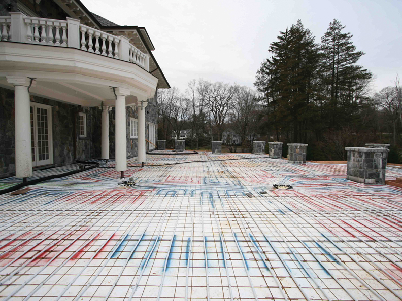 Zone one a stonecovered patio has living space underneath it