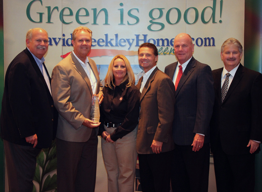 Rheem accepts its ldquoPartners of Choicerdquo Award from David Weekley Homes L to R David Weekley Jeff Reimer region sales manager Rheem Renae Turnbaugh tankless sales manager Rheem Mike Barnes corporate director national accounts Rheem John Johnson president and CEO David Weekly Homes and Bill Justus David Weekley Homesrsquo vice president of supply chain services Photo credit Cali Dalynn Bock Dalynnrsquos Desque