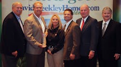 Rheem accepts its &ldquo;Partners of Choice&rdquo; Award from David Weekley Homes. (L to R): David Weekley; Jeff Reimer, region sales manager, Rheem; Renae Turnbaugh, tankless sales manager, Rheem; Mike Barnes, corporate director, national accounts, Rheem; John Johnson, president and CEO, David Weekly Homes; and Bill Justus, David Weekley Homes&rsquo; vice president of supply chain services. Photo credit: Cali Dalynn Bock, Dalynn&rsquo;s Desque.