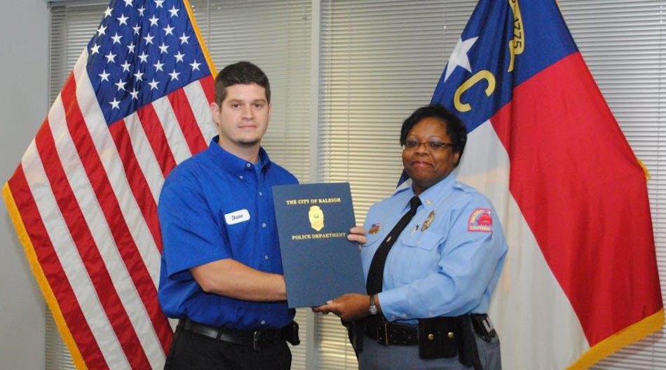 Shane St. Pierre, ARS/Rescue Rooter technician receives the citation from Cassandra L. Deck-Brown, Raleigh Police Chief.
