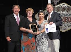 Presenting Nancy Eberhardt LC of the Wisconsin PHCC Auxiliary with the 2013 Larry Dore Member of the Year award is Joe Maiale L Vice President Wholesale Sales for InSinkErator Sandy Stack RC PHCC National Auxiliary President and Rob Grim R InSinkErator Senior Vice President of Sales Presenting Nancy Eberhardt LC of the Wisconsin PHCC Auxiliary with the 2013 Larry Dore Member of the Year award is Joe Maiale L Vice President Wholesale Sales for InSinkErator Sandy Stack RC PHCC National Auxiliary President and Rob Grim R InSinkErator Senior Vice President of Sales