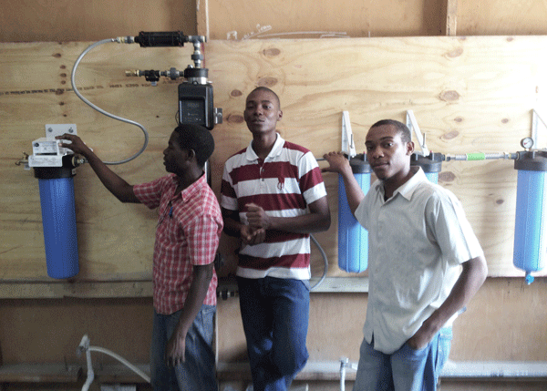 Four years after the 2010 earthquake efforts to restore access to clean drinking water continue throughout Haiti Plumbers Without Borders PWB worked with students at Haiti Tec teaching them to install water purification systems designed to help address this critical need