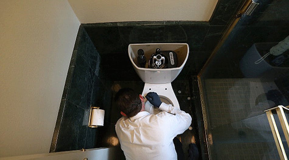 Benjamin Franklin Plumbing technician Todd Snider installs a 0.8 gallon per flush ultra-low flow toilet at a home in Novato, California.