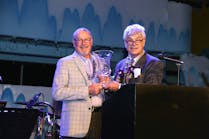 Mark Giebelhaus left receives the Col Scott Award from PHCC President Steve Rivers