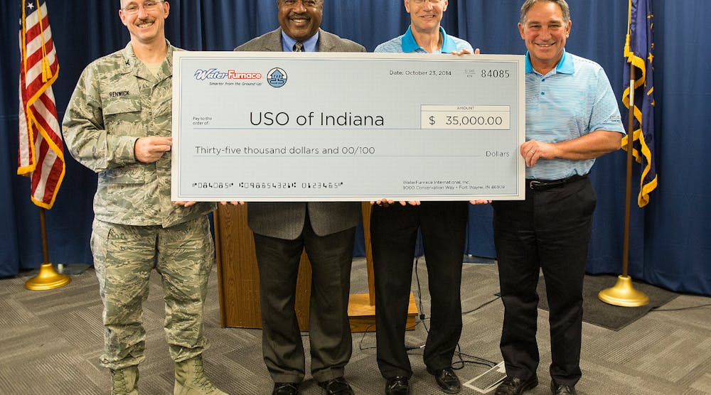 Tom Huntington, WaterFurnace president and CEO, presented the check during an Oct. 23 news conference at the company&rsquo;s corporate headquarters in Fort Wayne, Ind. From left to right: Col. Patrick Renwick, Wing Commander, 122nd ANG; James Pridgen, President &amp; CEO, USO of Indiana; Carl Huber, VP of Corporate Quality, WaterFurnace International; Tom Huntington, President &amp; CEO, WaterFurnace International.