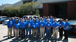 Ed Phillips (front row, third from left), along with the rest of his graduating class, celebrates the milestone of being the 5,000th graduate of Rheem&rsquo;s Tankless Training Program.