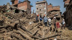 Volunteers and Nepal Scouts clear debris in a square on May 1, 2015 in Harisiddhi, Nepal. A major 7.8 earthquake hit Kathmandu mid-day on Saturday, and was followed by multiple aftershocks that triggered avalanches on Mt. Everest which buried mountain climbers in their base camps. Many houses, buildings and temples in the capital were destroyed during the earthquake, leaving over 6000 dead and many more trapped under the debris.