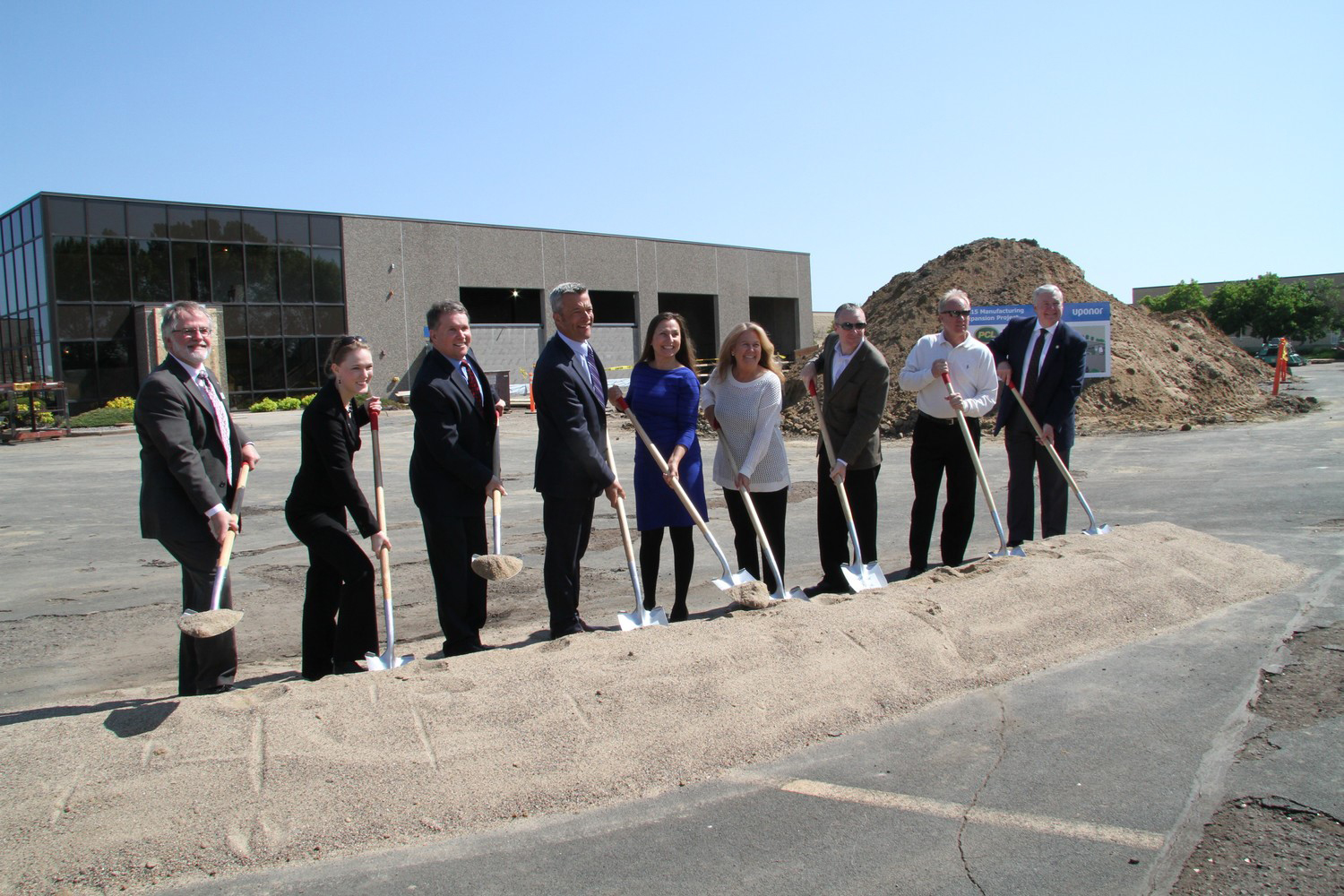 Political and community leaders celebrate the groundbreaking for Uponorrsquos new facility in Apple Valley Minn which is pursuing LEEDSilver certification From left to right Tom Lawell Apple Valley City Administrator Anna Wills State Representative Ed Kearney Apple Valley Chamber President Bill Gray President Uponor North America Apple Valley Mayor Mary HamannRoland Ruth Grendahl Apple Valley City Council Member Clint Hooppaw Apple Valley City Council Member John Bergman Apple Valley City Council Member Se