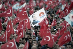 Supporters of Turkish President Tayyip Erdogan and Prime Minister and leader of the ruling Justice and Development Party AKP Ahmet Davutoglu wave national flags during a ceremony to mark the 562nd anniversary of the conquest of the city by Ottoman Turks on May 30 2015 in Istanbul Turkey Supporters of Turkish President Tayyip Erdogan and Prime Minister and leader of the ruling Justice and Development Party AKP Ahmet Davutoglu wave national flags during a ceremony to mark the 562nd anniversary of the conquest of the city by Ottoman Turks on May 30 2015 in Istanbul Turkey