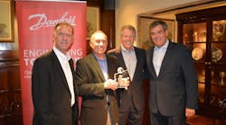Danfoss presents the 2015 EnVisioneer of the Year award to EMCOR Services Mesa Energy Systems. Pictured left to right: John Galyen, president, Danfoss North America; Charles Fletcher, executive vice president, EMCOR Services Mesa Energy Systems; Robert Lake, president and CEO, EMCOR Services Mesa Energy Systems; and Ricardo Schneider, president, Danfoss Turbocor Compressors.