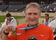 Dave Fletcher of Mansfield Plumbing at the finish line of the Akron Marathon