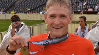 Dave Fletcher of Mansfield Plumbing at the finish line of the Akron Marathon.