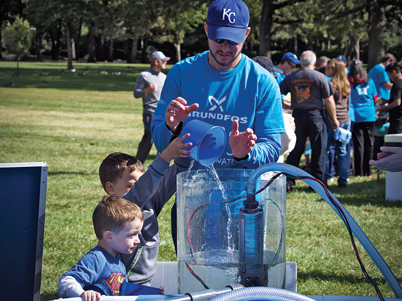 Bill Crooks Grundfos Customer Service Center Director participates in the companyrsquos Walk for Water event with his children