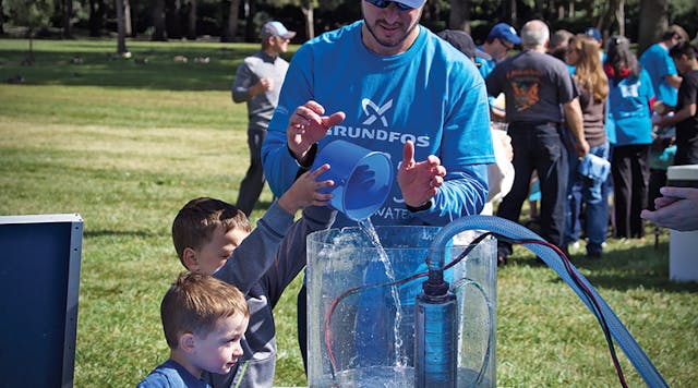 Bill Crooks, Grundfos Customer Service Center Director, participates in the company&rsquo;s Walk for Water event with his children.