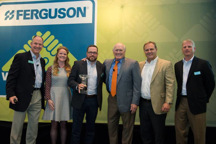 Accepting the Showroom Plumbing Vendor of the Year Award is Bert Magladry manager of US trade sales for LIXIL Water Technology Americas American Standard third from left Ferguson associates assisting with the award presentation included left to right Scott Russell senior vice president sourcing Mary Hannah Fout marketing manager showroom Terry Bradshaw celebrity spokesperson Sam Rose vice president ndash showroom and builder business and Rodney Grainger vice president strategic products