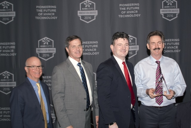 Left to right Clay Stevens president International Expo Co Westport Conn and Doug Young chairman AirConditioning Heating amp Refrigeration Institute AHRI Arlington Va present the AHR 2016 Innovation Award in the Indoor Air Quality IAQ category to Trevor Young CEOpresident and John Fischer director of technology and strategic business development SEMCO LLC Columbia Mo