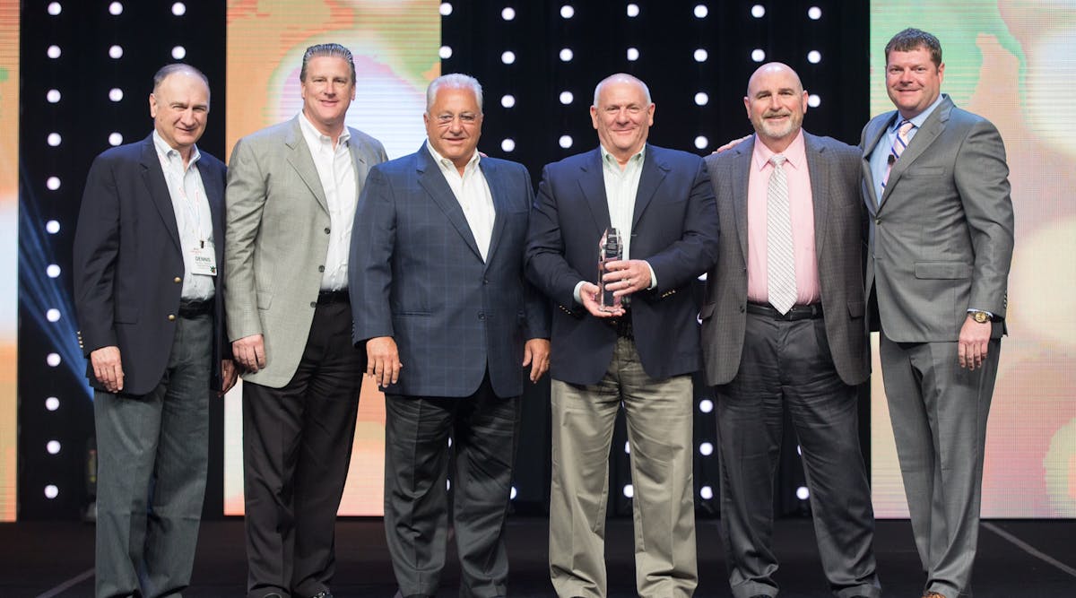 Left to right, Dennis Shuman (Chairman of the Management Methods Committee), Steve Heiderstadt, Robert Barbera, John Losey (holding the award) and John Fanneron of the BP Group, and Steve Dawson.