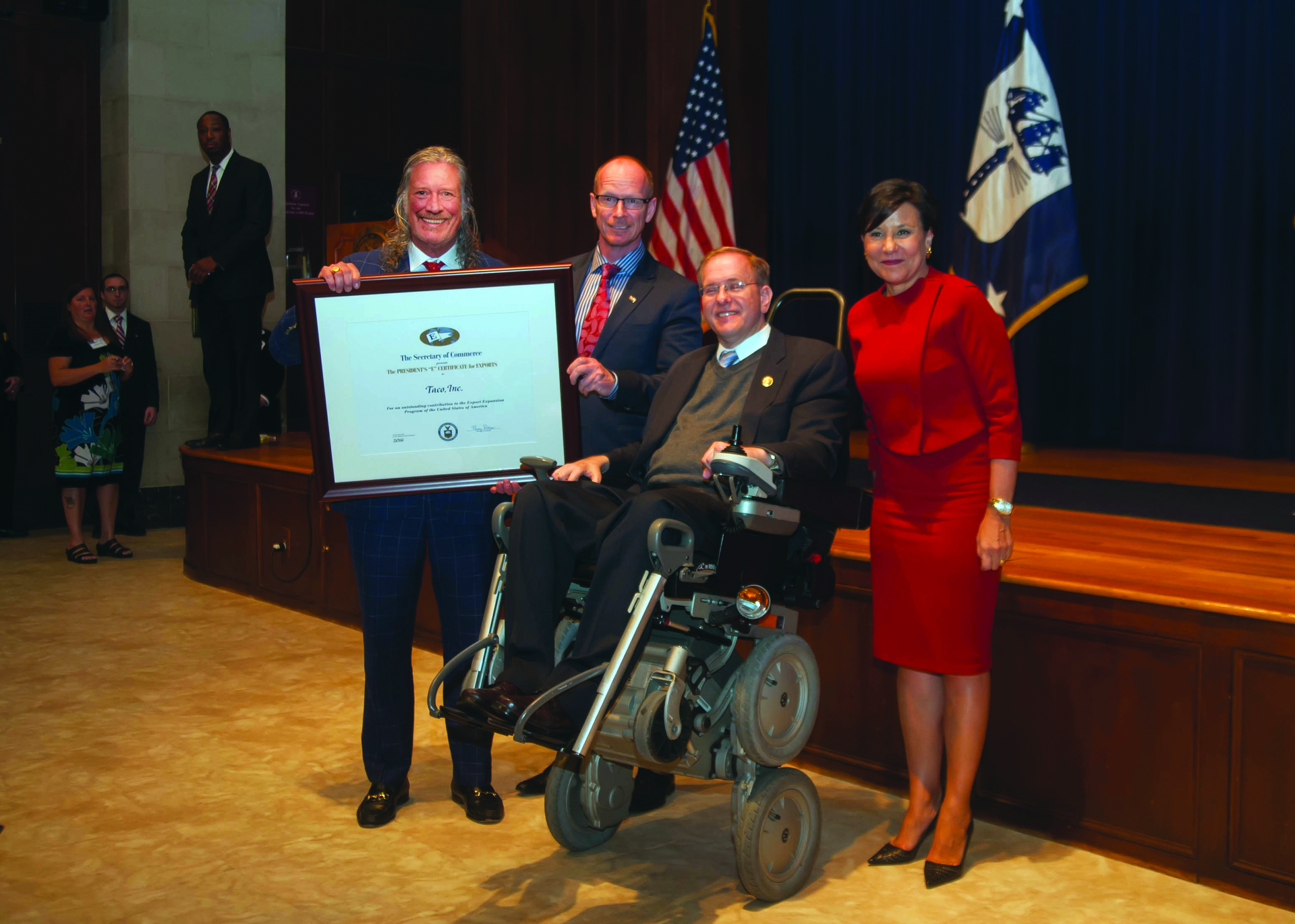 John Hazen White Jr Chairman and CEO of Taco Comfort Solutions holds the US Department of Commerce ldquoErdquo Award at Mondayrsquos ceremony in Washington DC With him are Wil VandeWiel Taco COO RI Congressman James Langevin and Penny Pritzker US Secretary of Commerce