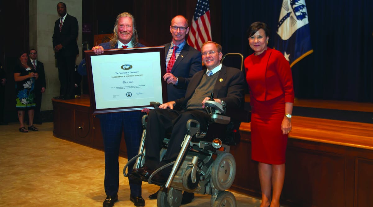 John Hazen White, Jr., Chairman and CEO of Taco Comfort Solutions holds the U.S. Department of Commerce &ldquo;E&rdquo; Award at Monday&rsquo;s ceremony in Washington, D.C. With him are Wil VandeWiel, Taco COO, RI Congressman James Langevin and Penny Pritzker, U.S. Secretary of Commerce.
