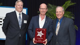 Taco Comfort Solutions COO Wil VandeWiel holds the Best Places to Work in RI award at the event ceremony. Flanking him (left to right) are Stephen Farrell, CEO of UnitedHealthcare, the Presenting Sponsor, and Mark Murphy, Editor of Providence Business News.
