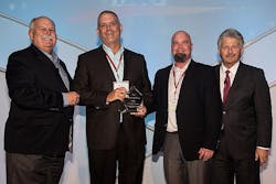 David Weekley left and Bill Justus right vice president of Supply Chain Services at David Weekley Homes present the Partners of Choice Award to Carl Hines national builder sales manager and Tom Stewart regional sales director at Uponor David Weekley left and Bill Justus right vice president of Supply Chain Services at David Weekley Homes present the Partners of Choice Award to Carl Hines national builder sales manager and Tom Stewart regional sales director at Uponor