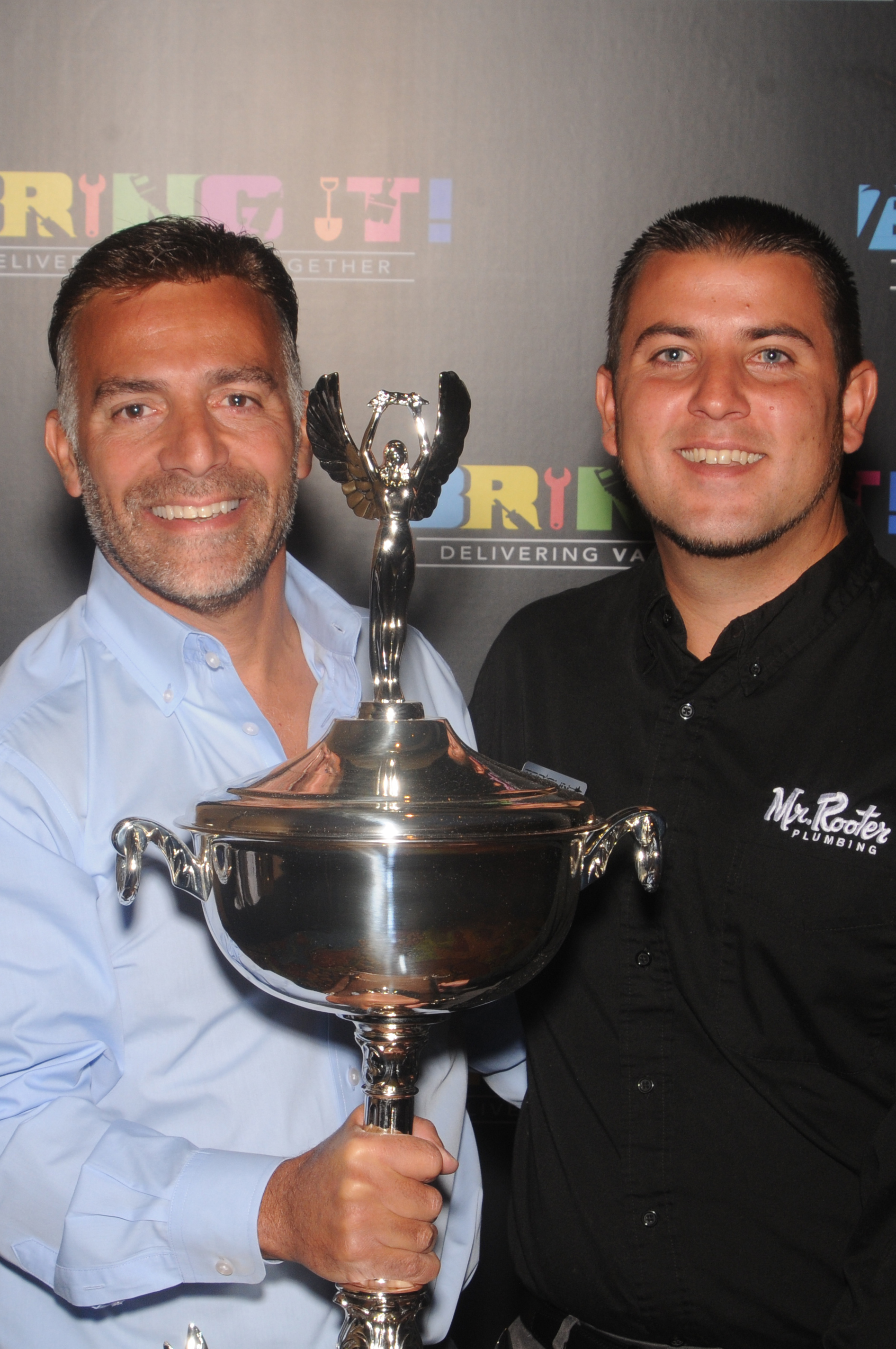 Vinnie Sposari and his son with the Top Gun Award