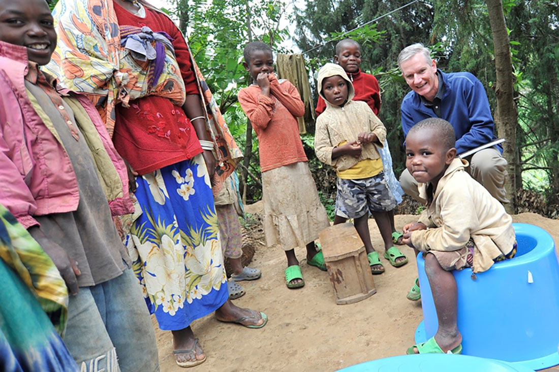 Jim McHale top right introducing affordable SaTo products in Rwanda