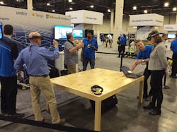 Attendees at the Trimble Dimensions conference in Las Vegas test drive the Microsoft HoloLens augmented reality headset loaded with building data from Trimble SketchUp and transmitted to the headset via Trimble Connect Attendees at the Trimble Dimensions conference in Las Vegas test drive the Microsoft HoloLens augmented reality headset loaded with building data from Trimble SketchUp and transmitted to the headset via Trimble Connect