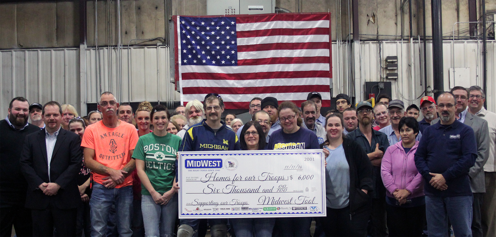 Midwest Tool employees pose with the award check