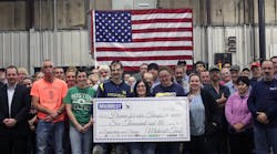 Midwest Tool employees pose with the award check.