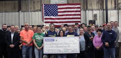 Midwest Tool employees pose with the award check Midwest Tool employees pose with the award check