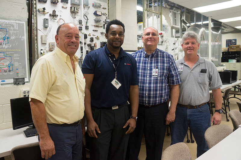 Left to right James Blackford III HVACR Educator Omar Mcintosh Technical Service Associate John Felser Assistant Principal and Brian Youngblood HVACR Educator