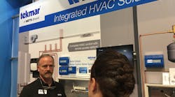 Discussing the latest in integrated solutions at the Watts booth.