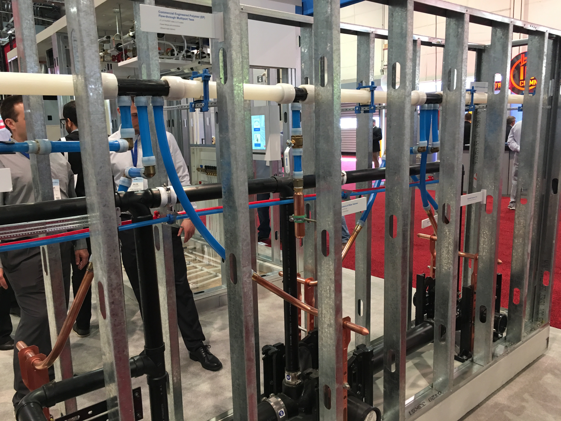 Uponorrsquos booth included a sample of a wall of backtoback fixture carriers with large diameter PEX and copper stubouts
