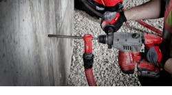 This SDS Vacuum Bit from Milwaukee Tool has a hollow core design, so the dust is removed through the drill bit itself. The vacuum attaches to the hammer drill at the base of the bit.