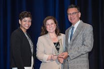 TDIndustries Chief People Officer Amy Messersmith (center) accepts the Torch Award for Ethics with Phylissia Clark (left) and Jay Newman (right) of the Better Business Bureau.