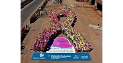 EMCOR Pink Hard Hats human ribbon for Breast Cancer Awareness Month EMCOR Pink Hard Hats human ribbon for Breast Cancer Awareness Month