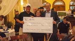 Comprehensive Energy Services, Inc. co-founders Todd and Shelly Morgan presented a $25,000 check to Florida Hospital Foundation president David Collis, right, on October 23.