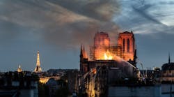 Flames and smoke are seen billowing from the roof at Notre-Dame Cathedral on April 15, 2019 in Paris, France.