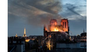 Flames and smoke are seen billowing from the roof at Notre-Dame Cathedral on April 15, 2019 in Paris, France.