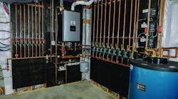 One section of the mechanical room at Michael Long&apos;s home. The circulator banks supply the radiant heating system.