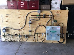 Forrest Anderson Plumbing and AC sets up oxygen gas manifold for donation to PIPE Industries for hands on learning .jpg Forrest Anderson Plumbing and AC sets up oxygen gas manifold for donation to PIPE Industries for hands on learning .jpg