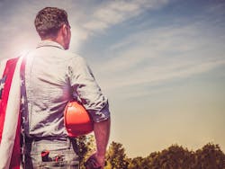 Worker_with_flag.jpg Worker_with_flag.jpg